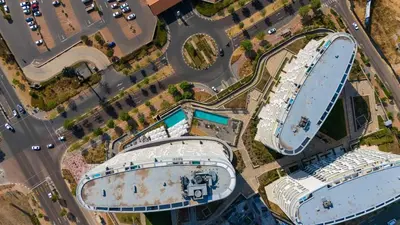 an overhead view of two large cruise ships in a parking lot at Bhonsane Executive Suite, Ellipse, Midrand in Midrand