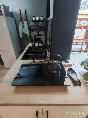a pot sitting on top of a stove in a kitchen at Polka Dot Airport Exec Suite in Kempton Park