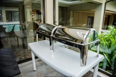 a hair dryer sitting on top of a white table at The Fine Line Lodge in Pretoria