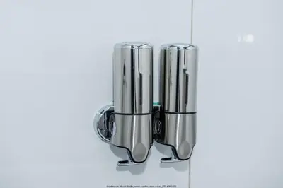 a group of metal cylinders sitting on a table at The Fine Line Lodge in Pretoria