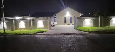 a house with lights on the side of a street at Morodi Guest Lodge in Witbank
