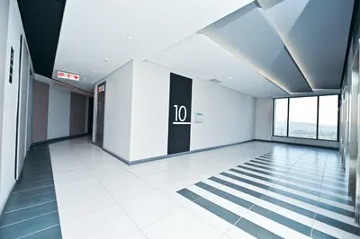 an empty room with a door in a building at Menlyn Maine Apartment with Sunbet Casino view in Pretoria