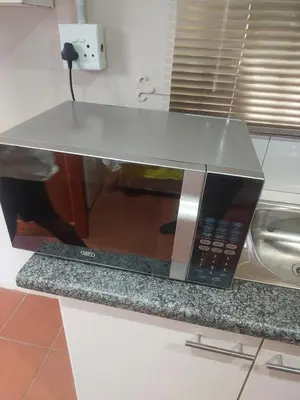 a microwave oven sitting on top of a counter at American horses 2 in Pretoria