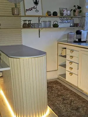 a kitchen with a counter with lights on it at Manchester Farmstay in White River
