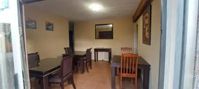 a dining room with a table and chairs at Ithiliens Grace Guesthouse in Pretoria