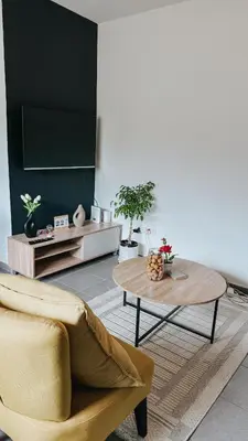 a living room with a couch and a table at Serenity suite in Midrand