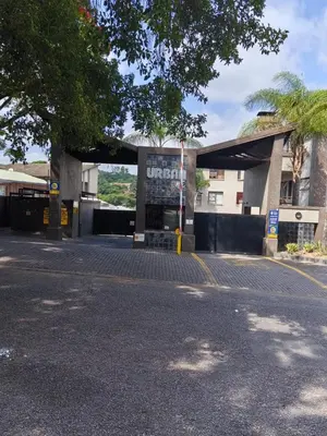 an empty parking lot in front of a building at The Crown in Nelspruit