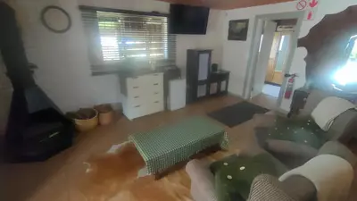 an aerial view of a living room with a couch at Tranquility Guest House in Sabie