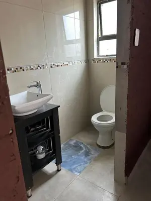 a bathroom with a sink and a toilet at EzekMary Res in Polokwane