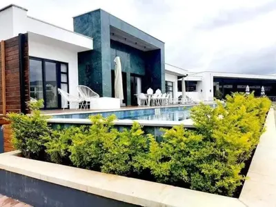 a house with a swimming pool in front of it at The Blyde 2 and half Bedroom in Pretoria