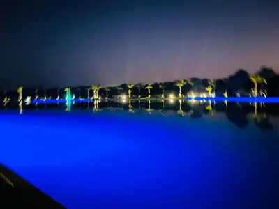 a large body of water at night with lights at The Blyde 2 and half Bedroom in Pretoria