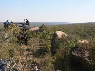 a group of people standing on a bench on a hill at Izintaba Private Game Reserve Waterberg in Vaalwater