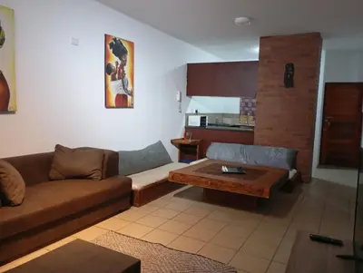 a living room with a couch and a coffee table at Midrand Lodge in Midrand