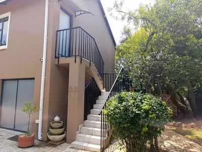 a stairway leading up to a house at Joy Haven - Flat in Centurion