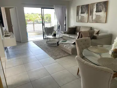 a living room with a couch and a table at The blyde tranquil lagoon view escape in Pretoria