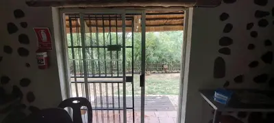 an open door with a view of a yard at Uitpak in Barberton