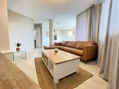 a living room with a couch and a coffee table at Menlyn Place 203 in Pretoria