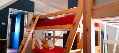 a bunk bed with a bear sitting on the bottom bunk at The Dutch House in Dullstroom