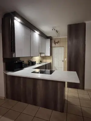 a kitchen with a sink and a counter top at Luxe Haven in Nelspruit