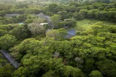 an aerial view of a house surrounded by trees at First Group Sanbonani Resort in Hazyview