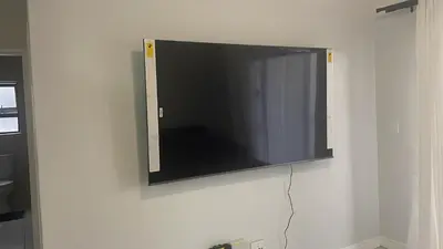 a flat screen tv hanging on a wall at The Blyde in Pretoria