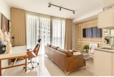 a living room with a couch and a table at KMaya at Ellipse Waterfall in Midrand