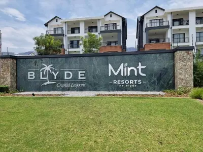 a sign for the hyde mini resort in front of a building at The Blyde Tranquil Mint Resort Pretoria in Pretoria