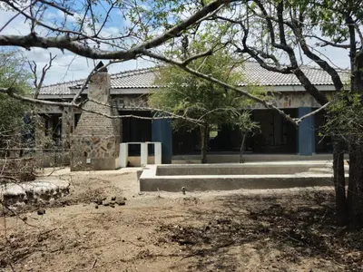 an old house with a stone building at Villa in the Wild in Marloth Park