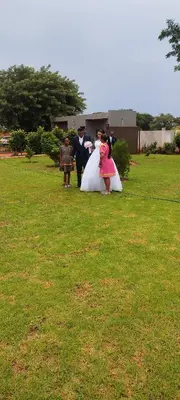 a group of people standing in a field at Marula Tree Lodge in Moletlane