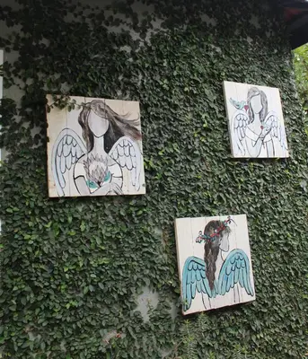 a group of drawings on the side of a wall at Angel Cottage in Tzaneen