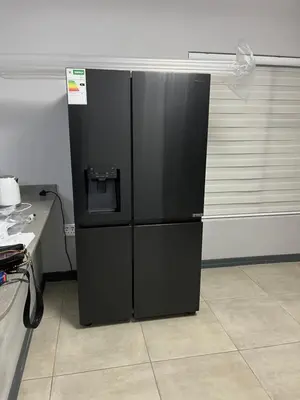 a black refrigerator in the corner of a room at Skylabs Housing in Polokwane
