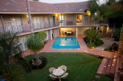 an aerial view of a house with a swimming pool at Loerie Guesthouse in Hoedspruit