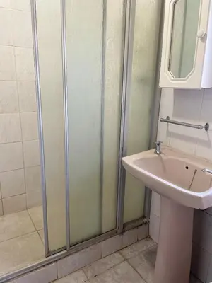a bathroom with a shower and a sink at Northgatelodges and Tours in Polokwane
