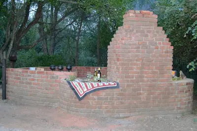 a brick wall with a flag on it at At Kruger's Heartbeat in Marloth Park