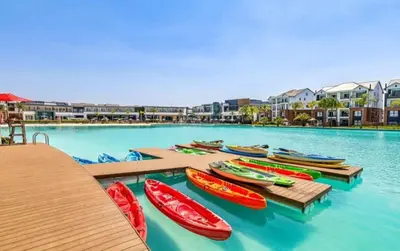 a group of boats are lined up in the water at The blyde apartment in Pretoria