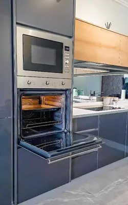 a kitchen with an open oven with a microwave at Ellipse Waterfall Executive Two Bedroom in Midrand