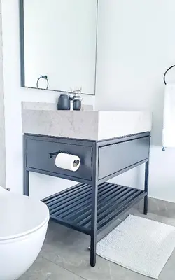 a bathroom with a sink and a toilet at Ellipse Waterfall Executive Two Bedroom in Midrand