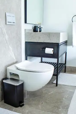 a bathroom with a white toilet and a sink at Ellipse Waterfall Executive Two Bedroom in Midrand