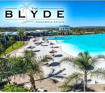a magazine cover of a beach with umbrellas and water at Blyde Cozy-TEE'S Apartment in Pretoria