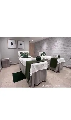 a room with two beds and a brick wall at Blyde Cozy-TEE'S Apartment in Pretoria