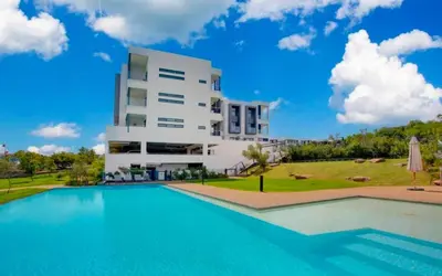 a villa with a swimming pool in front of a building at Luxury palace of Life in Midrand