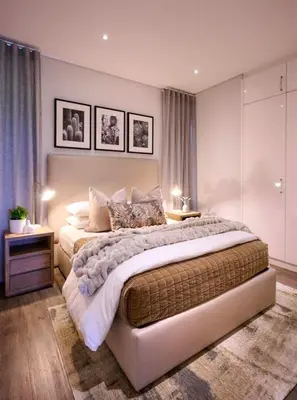a large bedroom with a large bed with two tables at Luxury palace of Life in Midrand