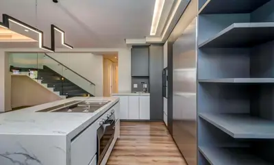 a kitchen with a sink and a stove top oven at Luxury palace of Life in Midrand