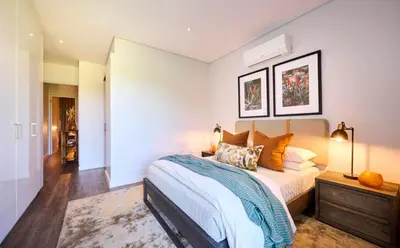 a bedroom with a bed and a dresser in it at Luxury palace of Life in Midrand