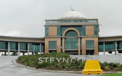 a building with a yellow object in front of it at Luxury palace of Life in Midrand
