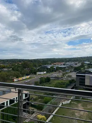 an aerial view of a city with a highway at Menlyn Maine Trilogy Apartment in Pretoria