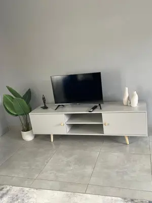 a white entertainment center with a flat screen tv on it at Serenity at Homely Escapes in Phalaborwa