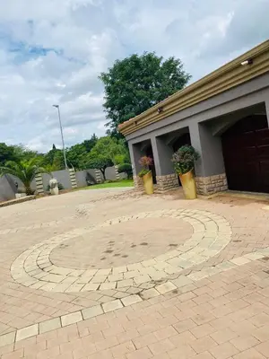 a circle in the middle of a brick driveway at The Adress in Midrand