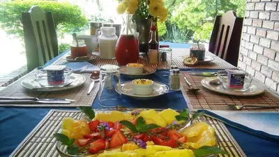 a table with a plate of fruit on it at Dublin Guest House in Sabie