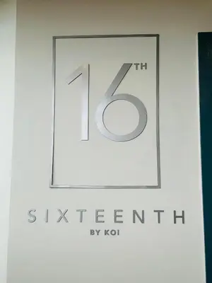 a sign with the number in a frame at French love, Menlyn Maine in Pretoria